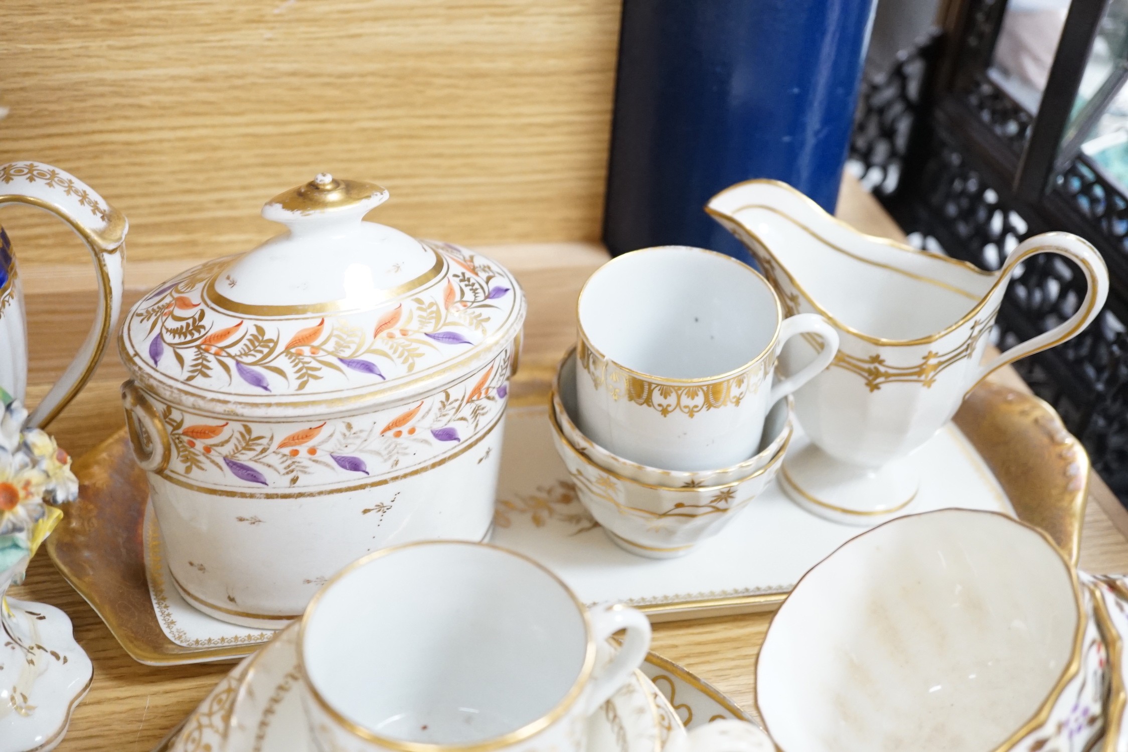 A large collection of mixed 19th century tea ware, a Staffordshire flat back, floral encrusted vase